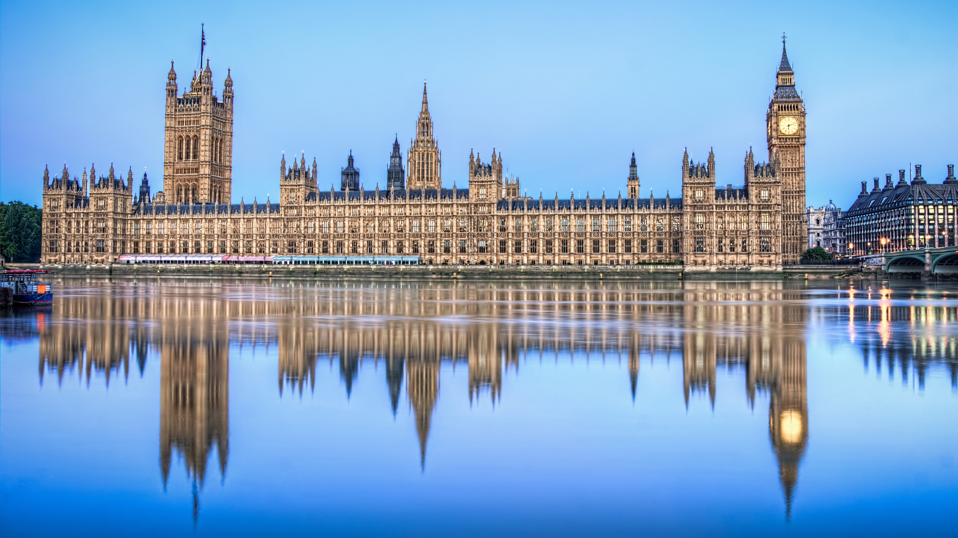 UK Houses of parliament viewed from across the Thames. Banner for an analysis of Labour manifestos